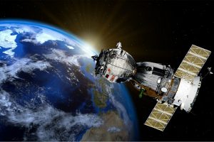 Un satellite orbita attorno alla terra: Ecor International realizza coponenti per questo settore